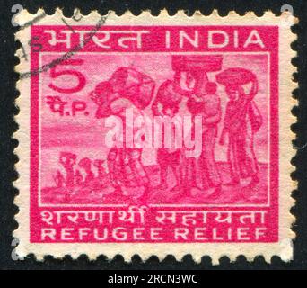 INDIA - CIRCA 1971: stamp printed by India, shows people with packages, circa 1971 Stock Photo