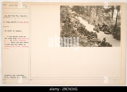 Soldiers taking a ten minute rest on their way from Camp Merritt, N.J., to Alpine Landing, N.J., where they will board a boat to France. The photo was taken on July 30, 1918, and was censored and released by the Military Intelligence Bureau censor on August 23, 1918. Stock Photo