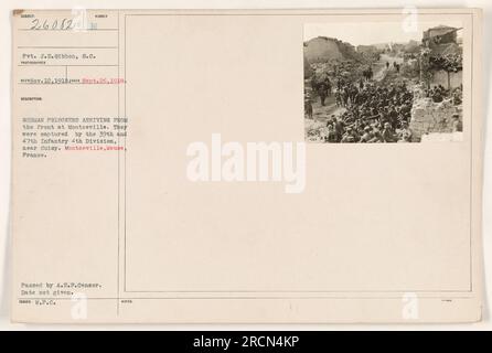 German prisoners of war arriving at Montzeville, captured by the 39th and 47th Infantry of the 4th Division near Cuisy. The photograph was taken on November 12, 1918. Photographer is Rico. The location is Montzeville, Meuse, France. The image has been approved by the A.E.F.Censor and issued by the War Department. Stock Photo