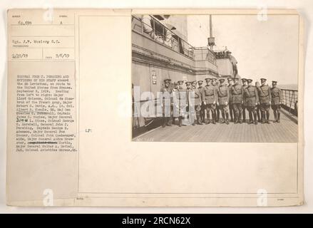 'General John J. Pershing and Officers of his Staff aboard the SS Leviathan, en route to the United States from France. In the photograph, taken on September 6, 1919, from left to right you can see Major Reading Lloyd Griscom, Colonel de Chan- brun of the French Army, Major Robert G. Davis, A.G., Lt. Col. Albert 8. Kuegle, GS, Maj Gen Charles C. Summerall, Captain James C. Hughes, Major General JOHN L. Hines, Colonel George C. Marshall, General John J. Pershing, Captain George E. Adamson, Major General Fox Connor, Colonel John Quekemeyer, aide, Major General Andre Brew- ster, obd-lork Curtin, Stock Photo