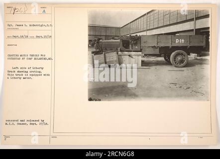 Sgt. James L. McGarrigle crates motor trucks for overseas deployment at Camp Holabird, MD during World War I. The photograph shows the left side of a Liberty Truck equipped with a Liberty motor. This image was censored and released by the M.I.D. Censor on September 27, 1918. Notes indicate it was taken on September 15, 1918. Stock Photo