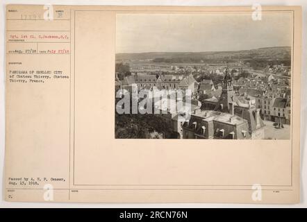 Soldier standing amidst the ruins of Chateau Thierry, a shelled city in France during World War I. The photograph, taken on July 27, 1918, showcases the devastation caused by military activities. It was approved by the A.E.F Censor and issued with additional notes. Sgt. 1st Cl. C. Jackson from South Carolina is the subject of the image. Stock Photo