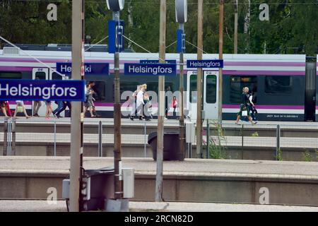 Commuters arriving at Helsinki railway station in Finland Stock Photo