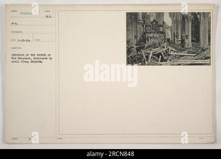 The image shows the interior of the church in Wez Marquart, Belgium, which has been severely damaged by shell fire during World War I. The destruction caused by the conflict is evident, with debris and rubble scattered throughout the church. This photograph was taken on May 12, 1919, as part of documenting American military activities during the war. Stock Photo