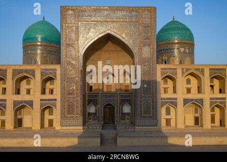 BUKHARA, UZBEKISTAN - SEPTEMBER 09, 2022: Facade of the ancient Mir-i-Arab madrasah on a sunny evening Stock Photo