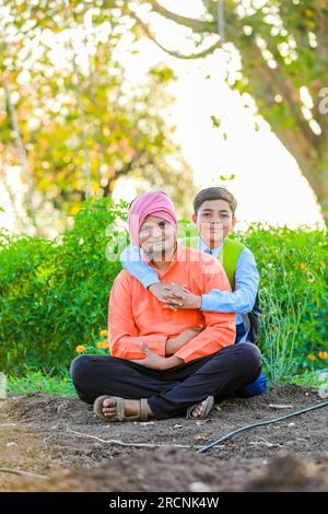 happy indian father and son , farmer and his son with smilli face Stock Photo