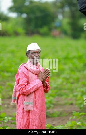 Indian happy farm worker , working in farm Stock Photo
