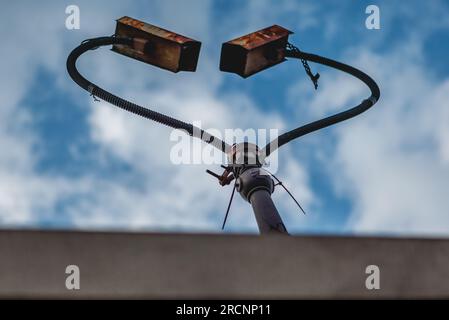 Surveillance cameras face each other in Hackney Wick in London. Stock Photo