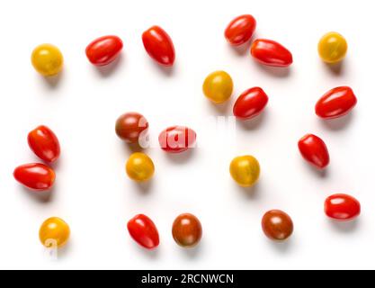 various colorful small tomatoes isolated on white background, top view Stock Photo