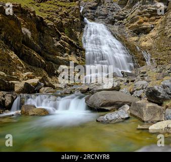 high mountain landscape in which waterfalls are seen through which a river descends towards the valleys, waterfalls rocks and water Stock Photo