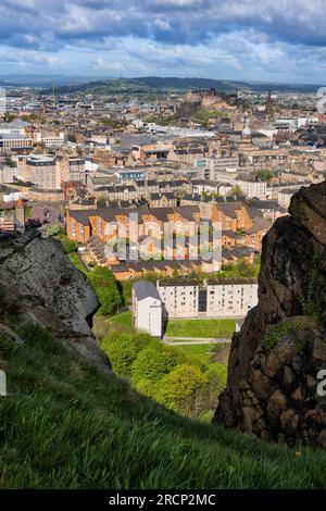 City of Edinburgh from cliff of Salisbury Crags in Holyrood Park in Scotland, UK. Stock Photo