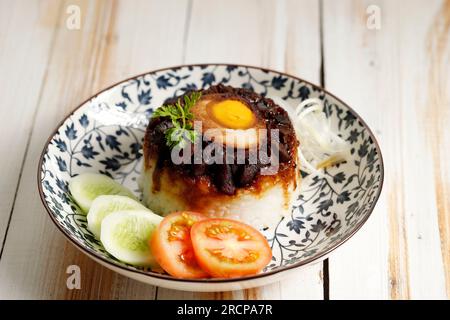 Dim Sum Loh Mai Kai Steamed Glutinous Rice with Chicken, Egg, Mushrooms, and Sausage Stock Photo