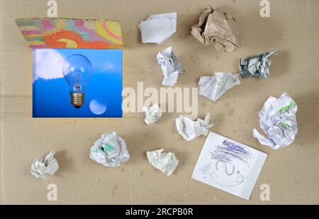 thinking outside the box,Innovation,idea,vision, business concept, grungy box with crumpled paper and light bulb,moon and clouds, symbolic and meataph Stock Photo