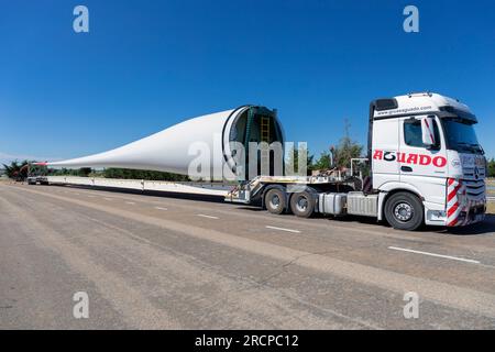 Europe, Spain, Castile and León, Abia de las Torres Motorway Services, Lorry carrying large Blade for construction of new Wind Turbine Stock Photo