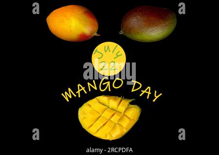 Two whole mangoes and one half of mango on black background with text: "Mango day. July 22" Stock Photo