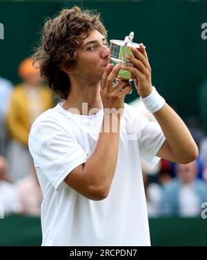 Mark Ceban celebrates with the trophy following the Boys 14 & Under Singles Final on day fourteen of the 2023 Wimbledon Championships at the All England Lawn Tennis and Croquet Club in Wimbledon. Picture date: Sunday July 16, 2023. Stock Photo