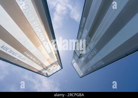 Greenwich, CT, USA-May 2022;  Low angle view of top of glass tower of the September 11 Memorial in Cos Cob Memorial Park with engraved names in glass Stock Photo