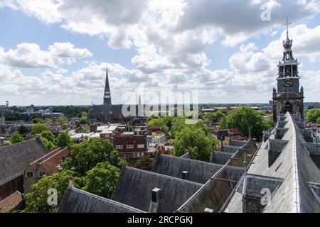 Gouda, The Netherlands-June 2022; View along roof with bell tower of St John's Church, the longest church in the Netherlands with 16th-century stained Stock Photo