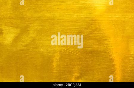 Shiny yellow leaf gold foil texture background Stock Photo
