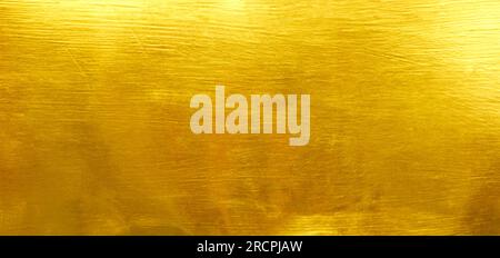 Shiny yellow leaf gold foil texture background Stock Photo
