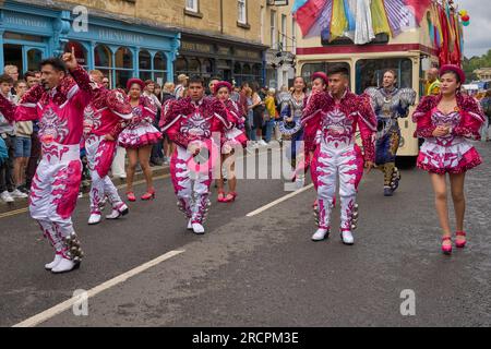 Caporales dancers in ornate costumes performing at the annual carnival as it progresses through the streets of the historic city of Bath in Somerset. Stock Photo