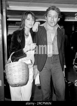 File photo dated 25/04/77 of Jane Birkin with husband Serge Gainsbourg at London's Heathrow Airport after arriving from Paris. The singer and actress has died at the age of 76, according to French media. Issue date: Sunday July 16, 2023. Stock Photo