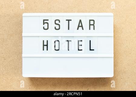 Lightbox with word 5 star hotel on wood background Stock Photo