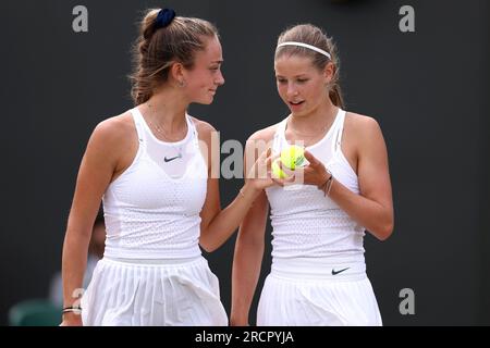 Isabelle Lacy (left) and Hannah Klugman in action against Alena Kovackova and Laura Samsonova during the Girls' Doubles Final on day fourteen of the 2023 Wimbledon Championships at the All England Lawn Tennis and Croquet Club in Wimbledon. Picture date: Sunday July 16, 2023. Stock Photo