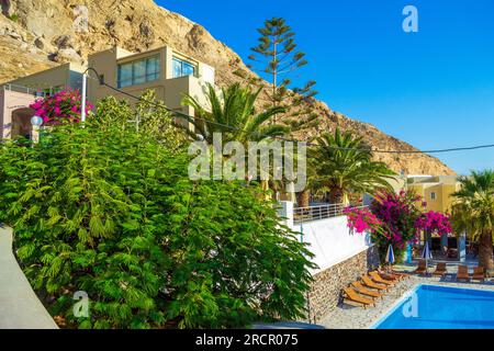 Resort villa with outdoor pool in  Kamari village at the foot of Messa Vouno Mountain, which reaches a height of 356m.Santorini island,Cyclades,Greece Stock Photo