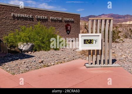 Extreme heat and heat record with 123 degrees Fahrenheit at the thermometer at Furnace Creek Visitor Center in Death Valley, United States Stock Photo