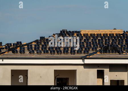 Roof tiles placed for laying on the roof in Turkey Stock Photo