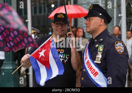 July 16, 2023, New York, New York, USA: (NEW) Cuban American Parade Celebrates Latin Culture. July 16, 2023, New York, USA :Despite persistent rain showers, the Cuban American Parade stands determined to showcase the vibrancy of Latin culture. undeterred by the weather, the festivities are set to begin, captivating spectators with its lively floats, spirited dancers, and captivating music with the presence of New York City Mayor Eric Adams and Tito Puente Jr., Paying homage to the late Celia Cruz the famous Cuban singer and Tito Puente Sr.Credit: Jorge Estrellado/Thenews2 (Foto: Jorge Estrell Stock Photo