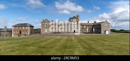 PENDENNIS CASTLE, FALMOUTH, CORNWALL, UK - JULY 5, 2023. Panorama landscape of the military barracks at Pendennis Castle in Cornwall with Falmouth in Stock Photo