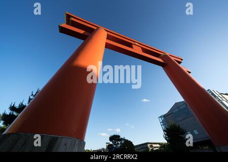 Large japanese torii gate at entrance of Heian Jingu religious shrine in Kyoto Japan seen on a luxury holiday as a tourist Stock Photo