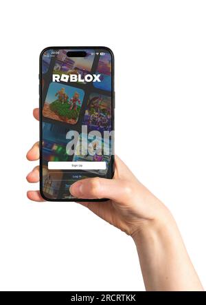 Berlin, Germany July 15 2023 Hand using Roblox game app, application. Stock Photo