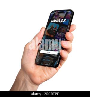 Foto de Roblox logo on the Roblox website seen through a magnifying glass  do Stock