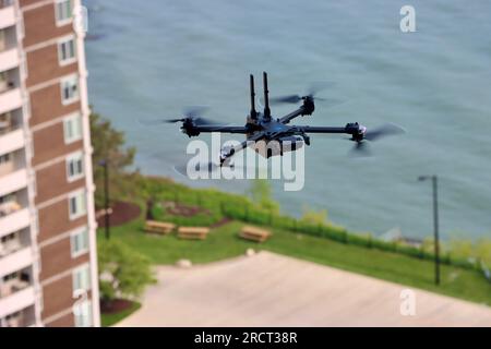 Surveillance drone near building on Lake Erie shoreline in Lakewood, Ohio Stock Photo