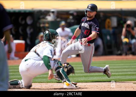 Minnesota Twins' Edouard Julien (47) talks to Carlos Correa