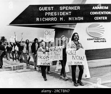 Anaheim, California:   October 30, 1970 Antiwar demonstrators march in front of the Anaheim Convention Center where Nixon is to speak. He will enter through the back door to avoid the crowds as protestors in San Jose threw rocks and eggs at him after a rally there. Stock Photo