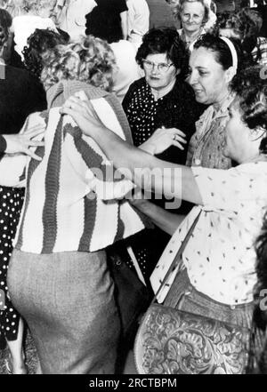 New Orleans, Louisiana:  December 6, 1960 Kirstin Steene, an English professor at the Univeristy of Alberta in Canada, is roughed up by local women demonstrators at the Frantz Elementary School as she was filming the first days of integraton at the school. Stock Photo