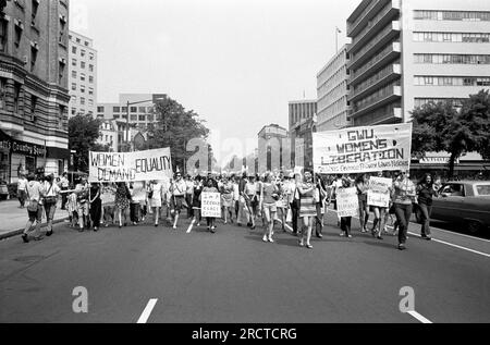 Washington, D.C.:  August 26, 1970 Women carrying banners and signs while marching from Farrugut Square to  Lafayette Park during a demonstration for equal rights for women. Stock Photo
