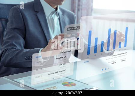 Businessman or analyst touching futuristic augmented reality  virtual touchscreen for business transactions and investing risk analysis and business p Stock Photo