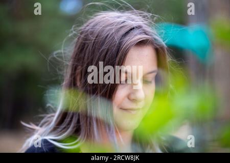 Close-up of a happy young woman in nature (model released) Stock Photo