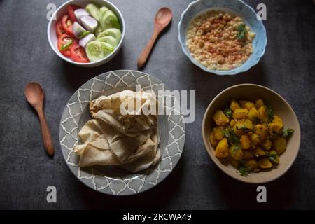 Popular Indian veg lunch rumali roti or Indian bread and alu jeera or potato masala Stock Photo