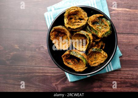 Dry Patra is an Indian dish made with colocasia leaves that are coated with a spicy gram flour batter and deep fried. It's a popular dish in Gujarat. Stock Photo