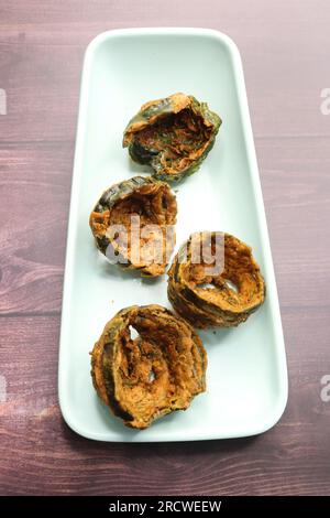 Dry Patra is an Indian dish made with colocasia leaves that are coated with a spicy gram flour batter and deep fried. It's a popular dish in Gujarat. Stock Photo