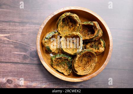 Dry Patra is an Indian dish made with colocasia leaves that are coated with a spicy gram flour batter and deep fried. It's a popular dish in Gujarat. Stock Photo