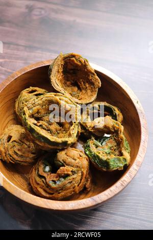 Dry Patra is an Indian dish made with colocasia leaves that are coated with a spicy gram flour batter and deep fried. It's a popular dish in Gujarat. Stock Photo