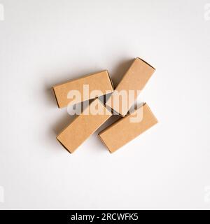 Four brown cardboard boxes with shadow. Top view, copy space. Stock Photo