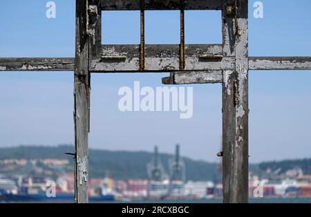 Looking out the window of an abandoned building in Lisbon, Portugal, during a sunny day Stock Photo
